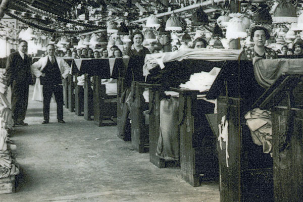 B1-250a: Burling and mending department at Salts Mill, Christmas 1936