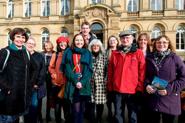 Dan Snow with volunteers outside Victoria Hall, Saltaire