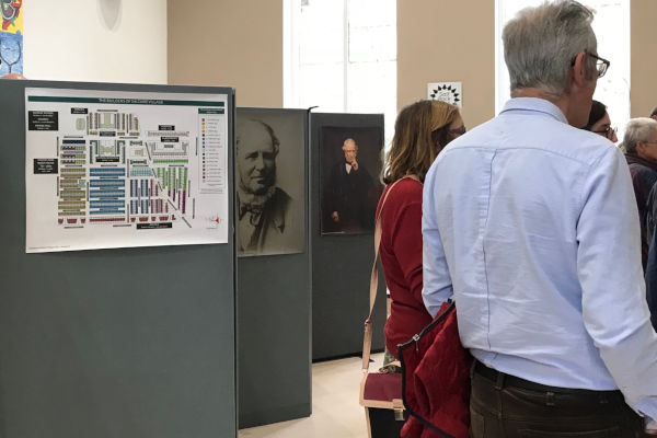 Visitors and display panels at the Heroes and heroines Exhibition presented by the Saltaire Collection 2019